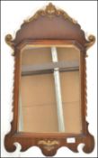 A 20th Century Regency revival walnut and gilt wall mirror / pier, the central panel mirror glass