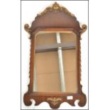 A 20th Century Regency revival walnut and gilt wall mirror / pier, the central panel mirror glass