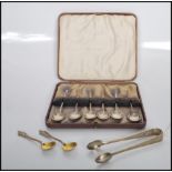A cased set of six early 20th Century Art Deco silver hallmarked coffee spoons of simple form.