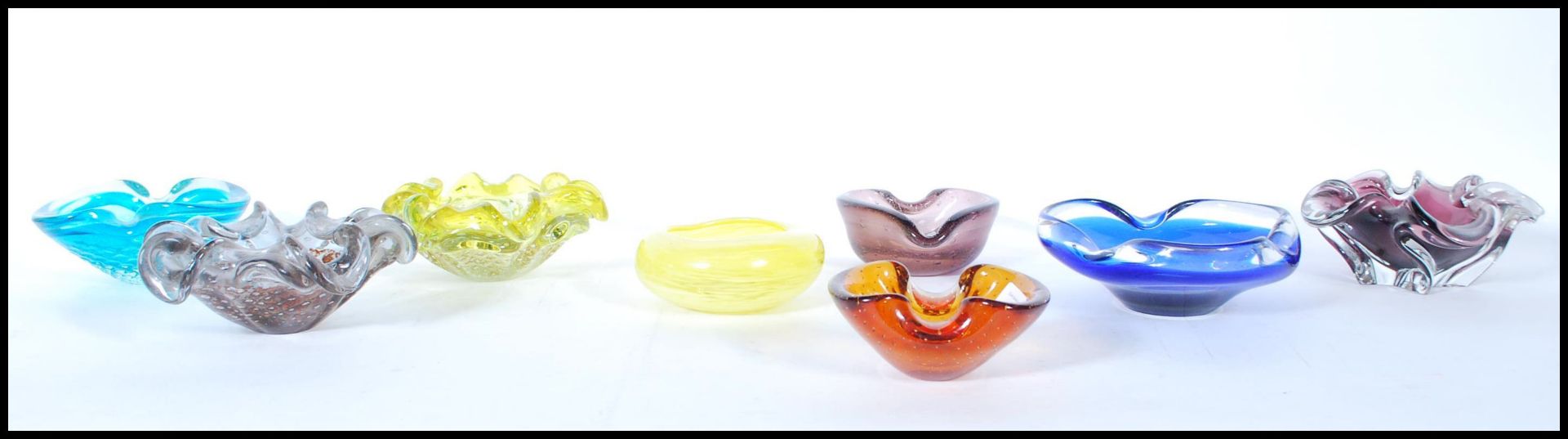 A collection of mid 20th Century studio art glass ornamental bowls to include a selection of Czech