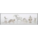 A collection of white metal figurative animals to include a kangaroo with crystal glass body,
