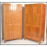 A pair of 20th Century Air Ministry Staverton oak wardrobes, each robe with full length panel