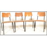 A set of 4 mid 20th century bentwood and tubular metal industrial stacking chairs. Each with painted