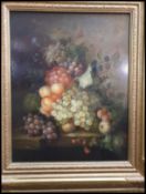 A 20th century oil on panel still life study / painting of fruits on a table set to a black laquer