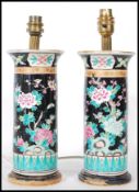 A pair of late 19th Century Chinese cylindrical ceramic vases decorated with all-over stylised