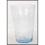 A mid 20th Century large vintage retro blue glass vase of cylindrical tapering form having wave