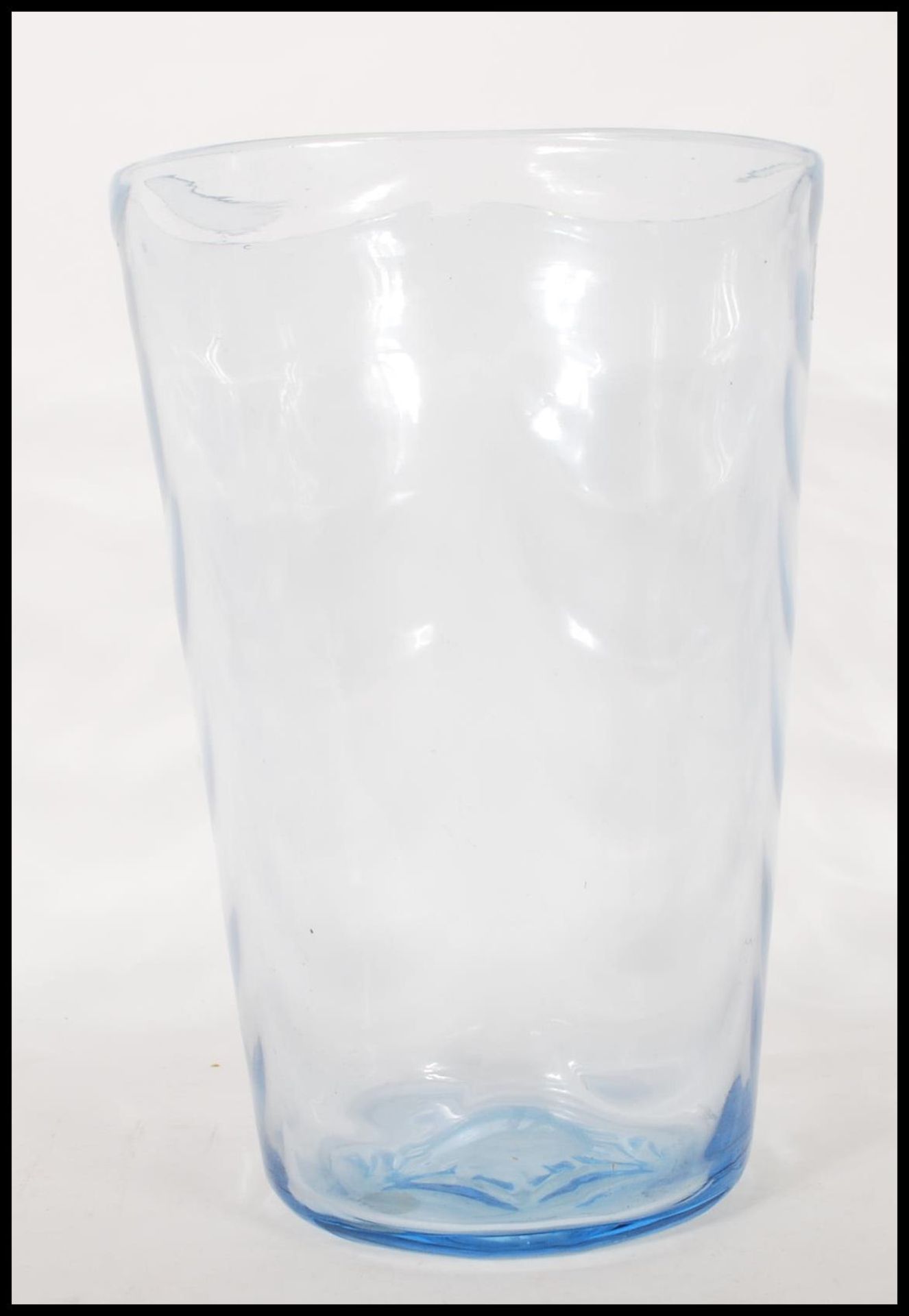 A mid 20th Century large vintage retro blue glass vase of cylindrical tapering form having wave