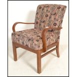 A 20th Century vintage Parker Knoll open framed bentwood armchair, the overstuffed seat pad and