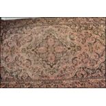 A 20th Century Persian Islamic runner floor rug having a red ground with black floral patterned