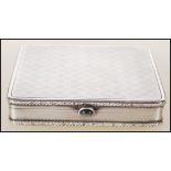 An early 20th Century continental silver cigarette case of square form having relief floral