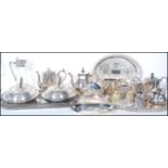 A large collection of early 20th Century silver plated dinner and tea ware, to include reeded design