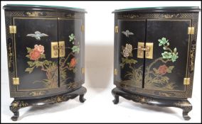 A pair of 20th Century Japanese Shibayama effect painted black lacquered corner cupboard cabinets,