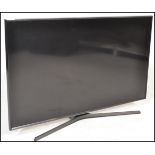 A large modern Samsung Flat Screen TV / Television believed to be 43" screen complete with the