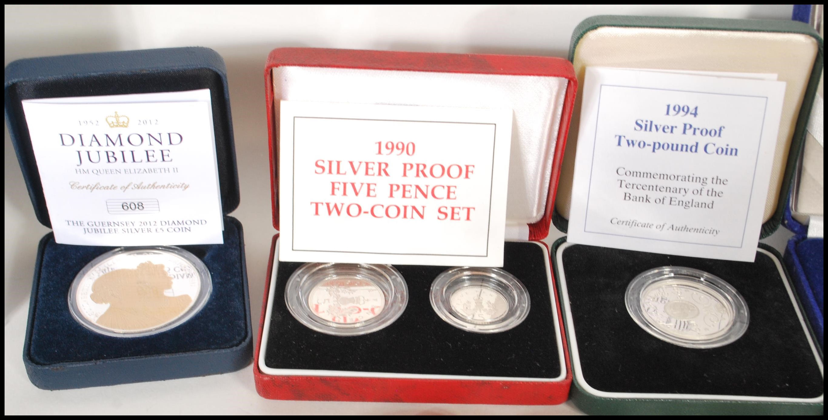 A collection of commemorative coins and silver proof coins to include D-Day £5 Coin Presentation - Image 4 of 9