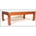 A large 20th Century mahogany rectangular coffee table in the Chinese taste, set with brass mounts