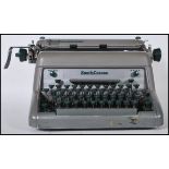 A vintage 20th Century industrial typewriter by Smiths Corona, enamel finish with makers mark to