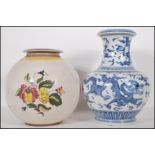 A 20th Century Chinese blue and white large baluster vase, dragons chasing a flaming pearl to the