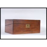 A 19th Century Victorian walnut veneer writing slope having brass escutcheon and brass cartouche