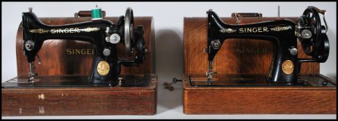2 19th century oak cased Singer sewing machines. Each within the original dome top carry cases.