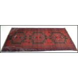 A hand knotted woolen Herati Baluchi carpet floor