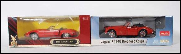 Two boxed diecast scale model cars to include the Jaguar Xk140 drophead coupe by Sun Star and a 1971