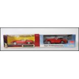 Two boxed diecast scale model cars to include the Jaguar Xk140 drophead coupe by Sun Star and a 1971