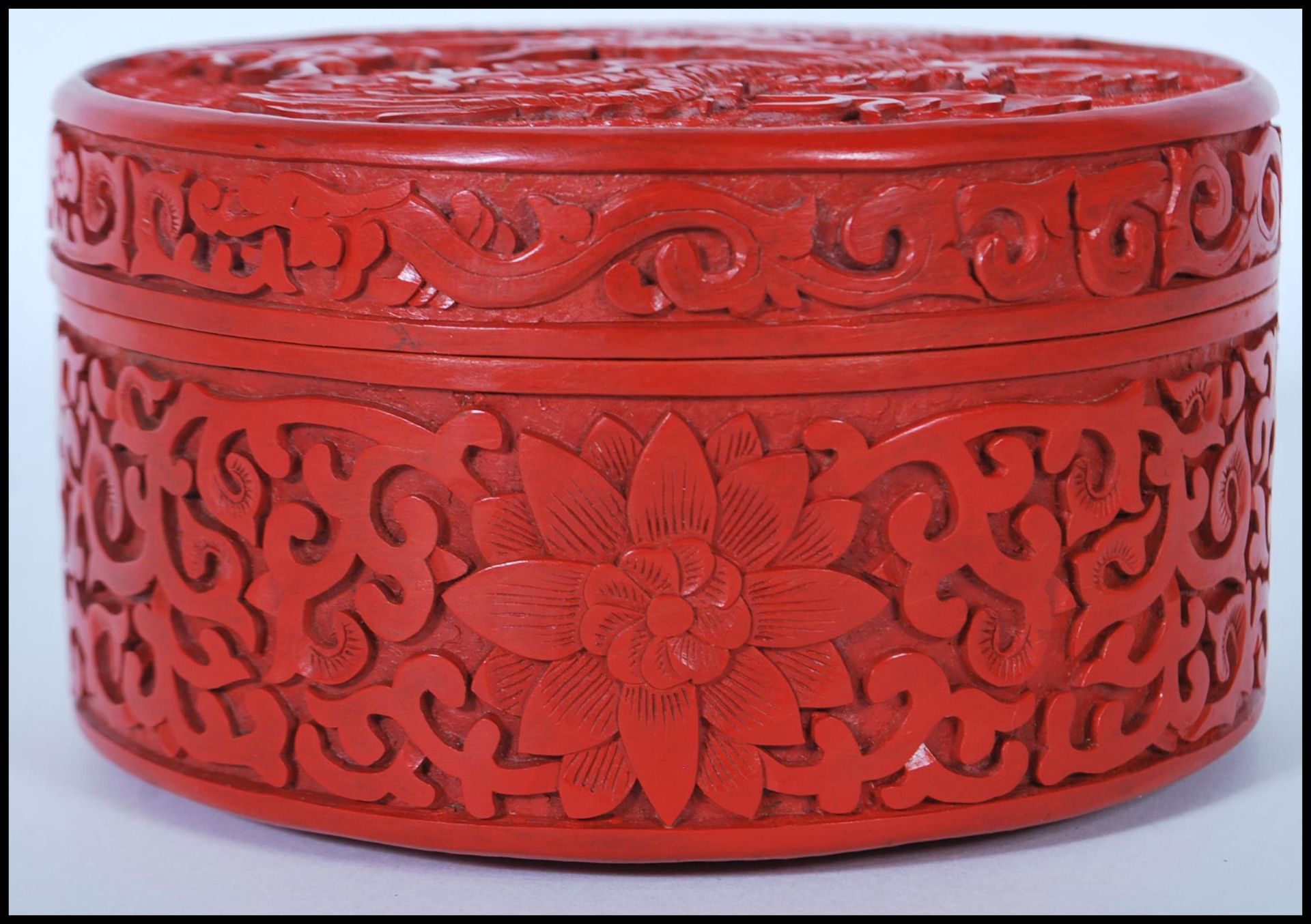 A 20th Century Chinese Cinnabar round desk top box of round form having carved relief of a Chinese - Image 2 of 7