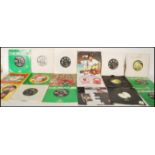 A collection of vintage 7" 45 RPM EP vinyl records to include The Beatles Singles Collection 1962-