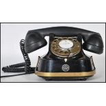 A vintage 20th Century RTT Bell kettle telephone by MFG Company circa 1950s, finished in black