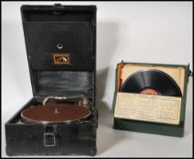 An early 20th Century portable HMV gramophone model 101 having a black leather case with a no. 4