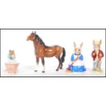 A group of 20th Century Beswick and Royal Doulton ceramic ornaments to include a brown horse and a