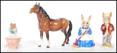 A group of 20th Century Beswick and Royal Doulton ceramic ornaments to include a brown horse and a