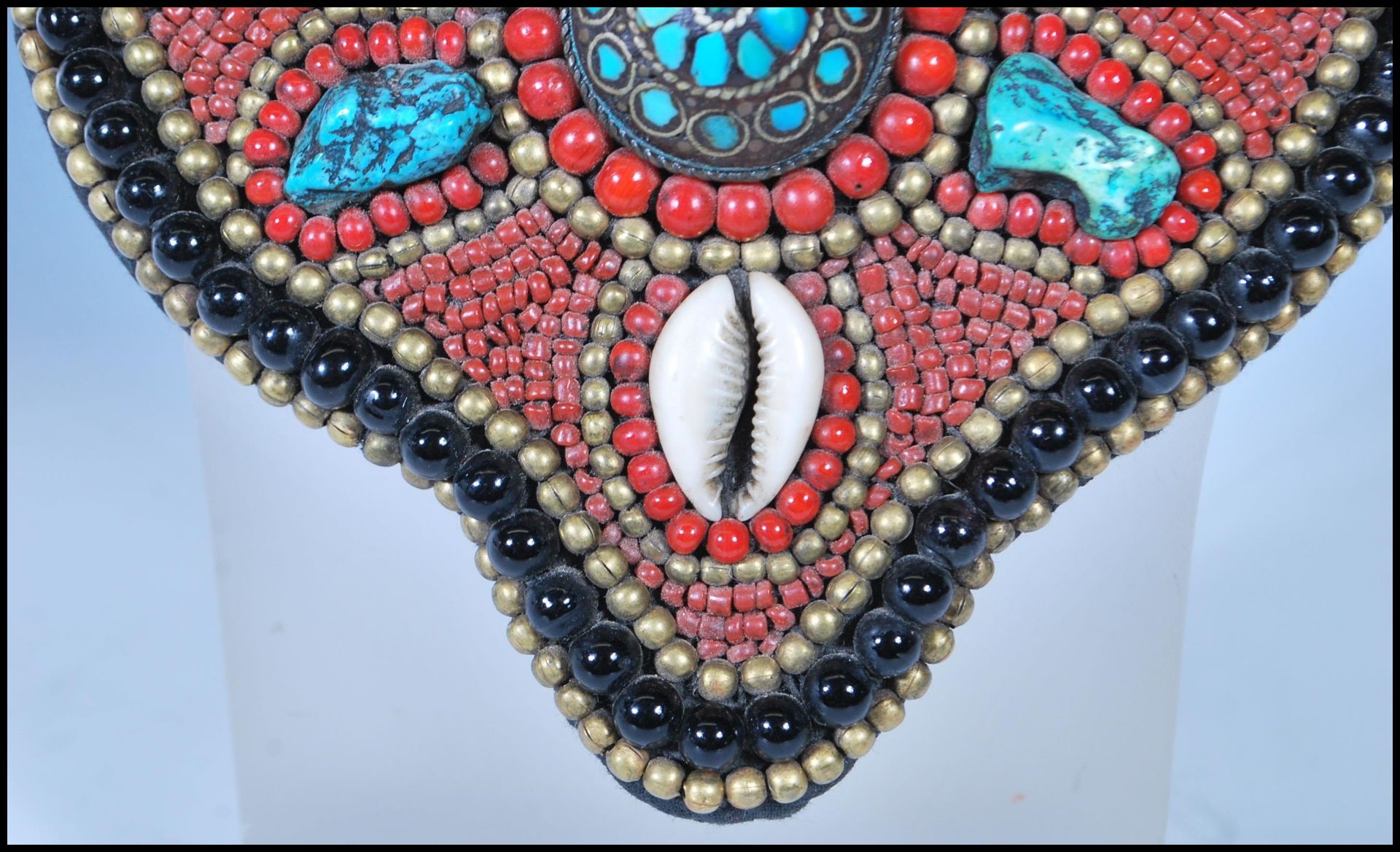 A 20th Century Tibetan tribal collar necklace constructed from a fabric panel stitched with red - Image 2 of 17