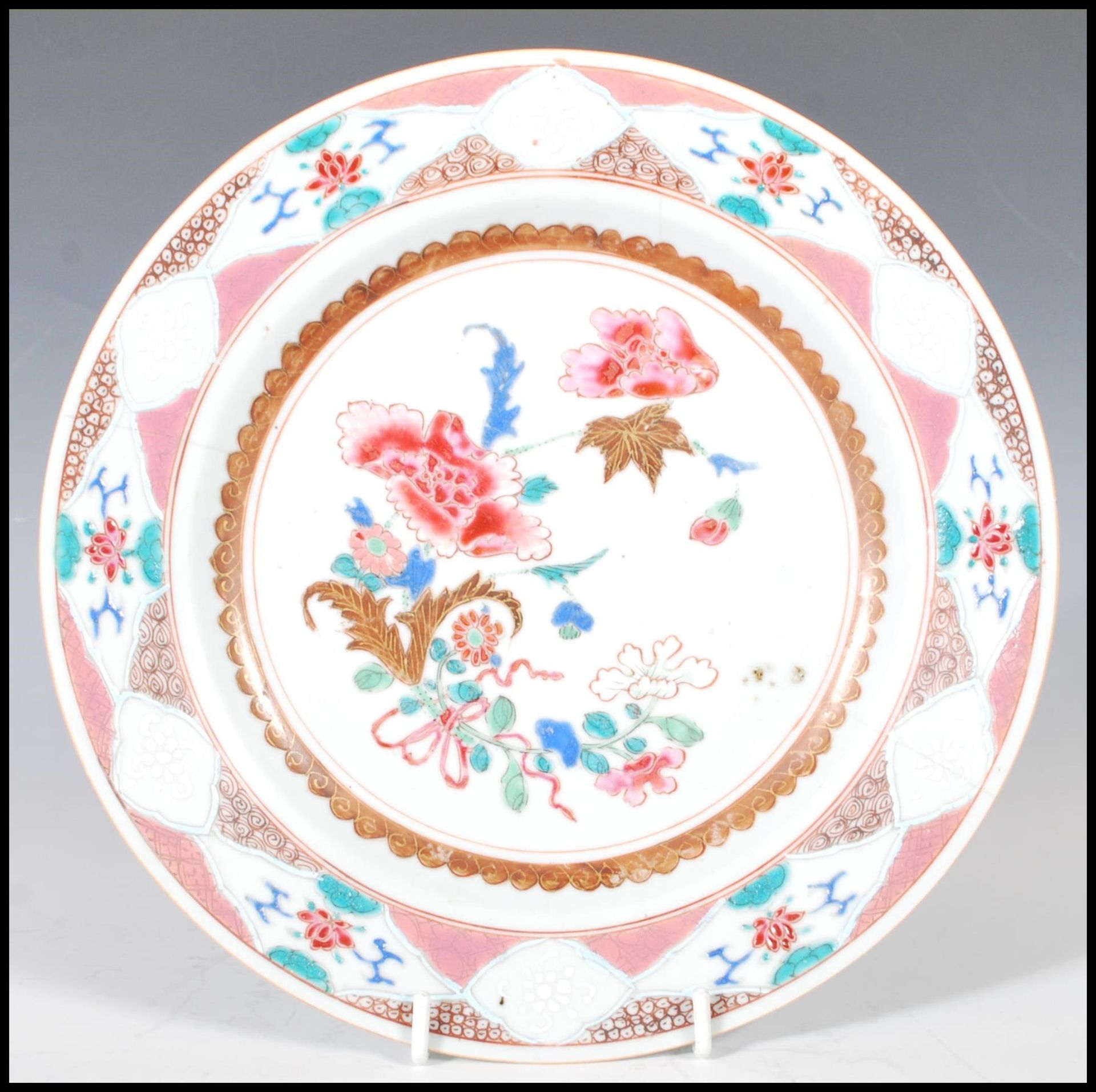 An 18th Century Chinese famille rose porcelain plate having hand painted central cartouche panel