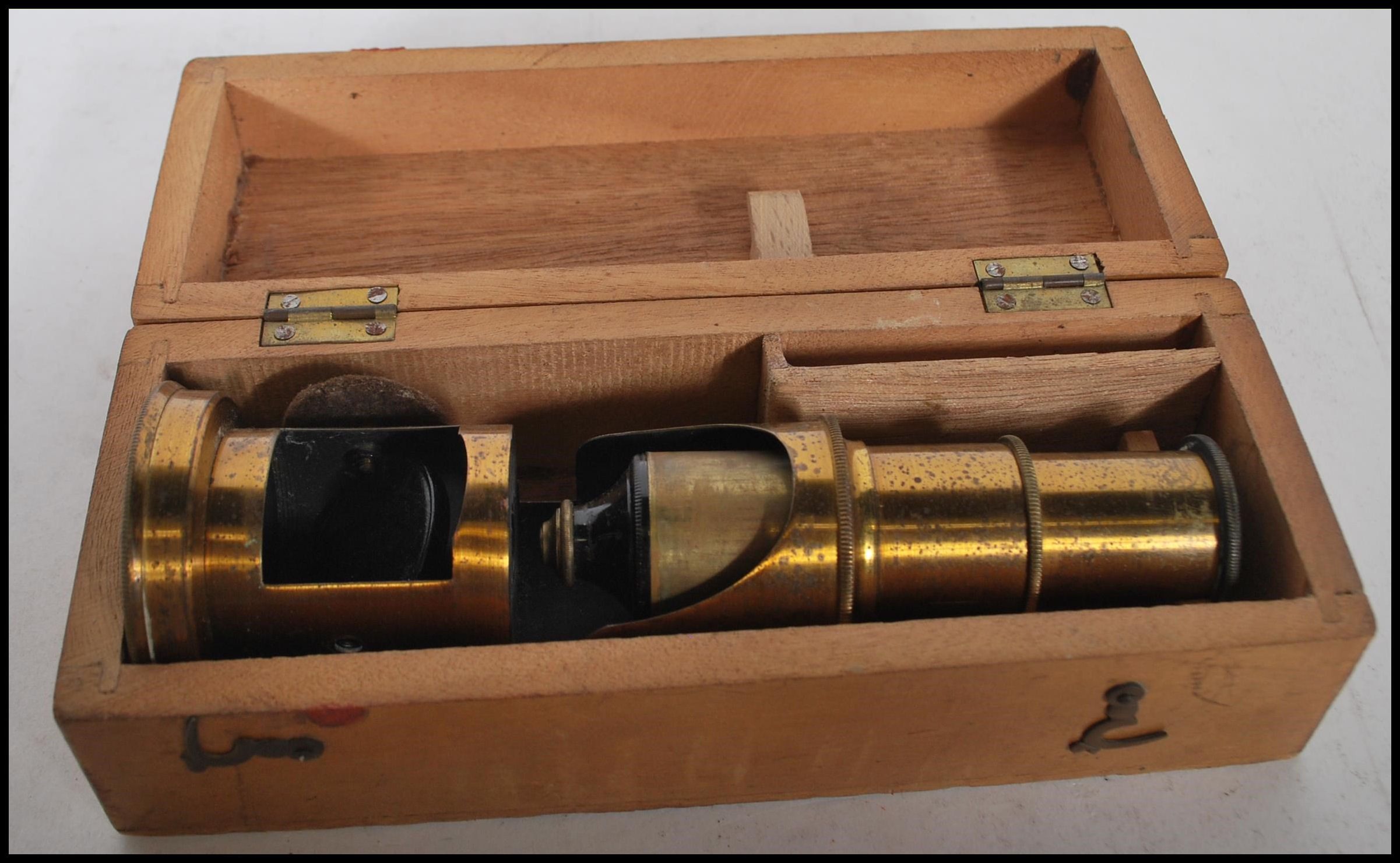 A late 19th Century brass students pocket cased microscope, adjuster to side fitted in a hinged - Image 7 of 7