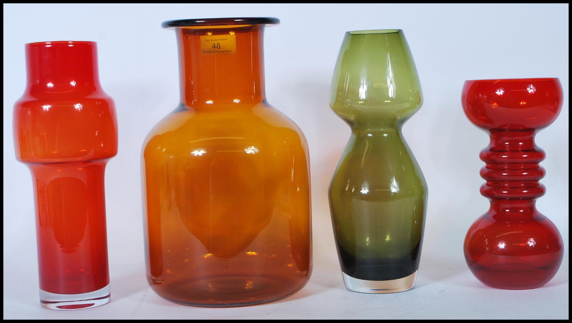 A collection of four vintage retro studio art glass vases to include an example by Dartington,