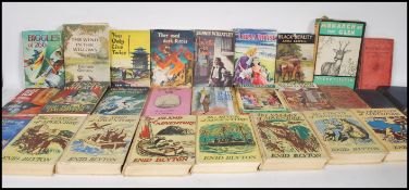 A selection of vintage books to include multiple E