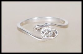 A 950 platinum solitaire diamond ring having an op