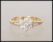 A stamped 585 14ct gold ring having a flower head