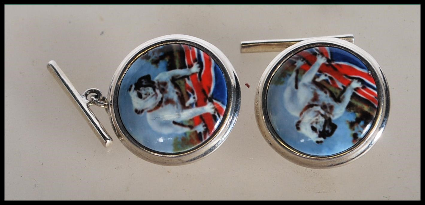 A pair of stamped 925 silver cufflinks having cent