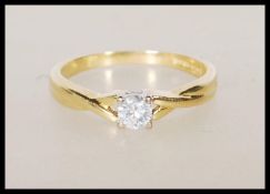 A hallmarked 18ct yellow gold solitaire diamond ri