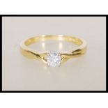 A hallmarked 18ct yellow gold solitaire diamond ri