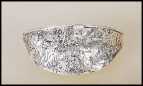 A stamped 925 sterling silver purse in the form of