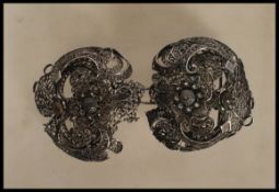 A 20th Century filigree belt buckle in a layered f