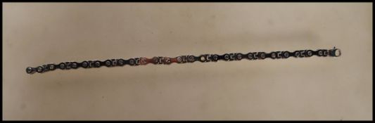 A stamped 375 9ct white gold bracelet in the form