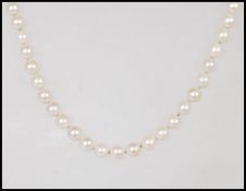 A single string cultured pearl necklace having a h