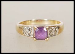 A 9ct gold English hallmarked ring set with a cent