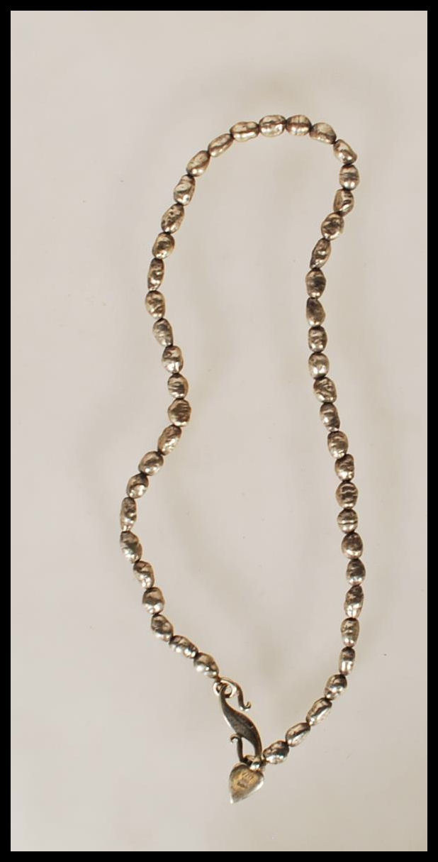 A silver hallmarked ladies necklace constructed fr