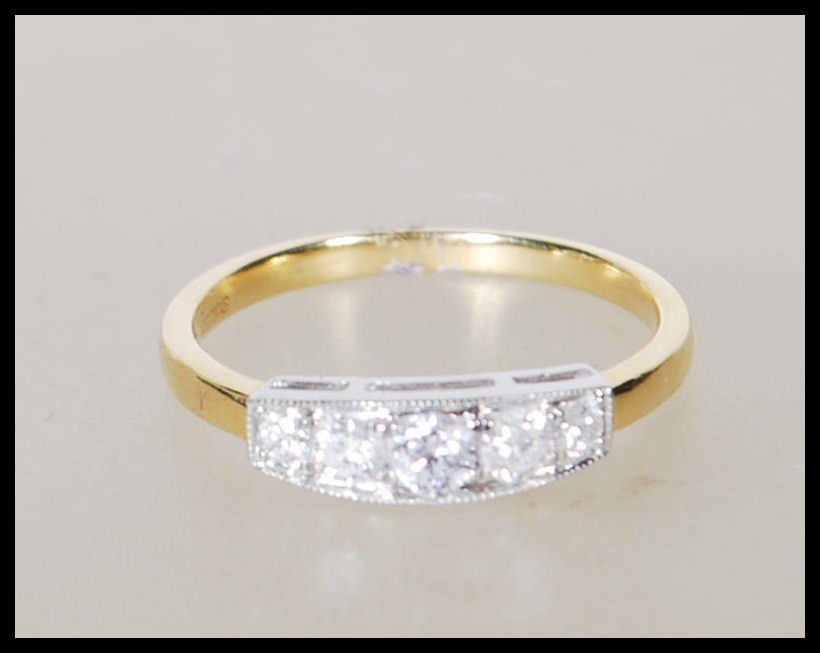 A stamped 750 18ct yellow gold ladies dress ring i