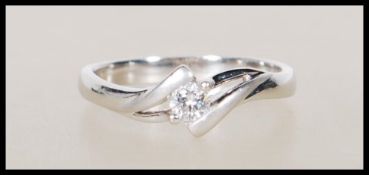 A stamped 18ct white gold solitaire diamond ring s